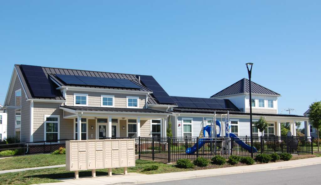 exterior shot of Our Lady of Grace community center with solar PV on roof
